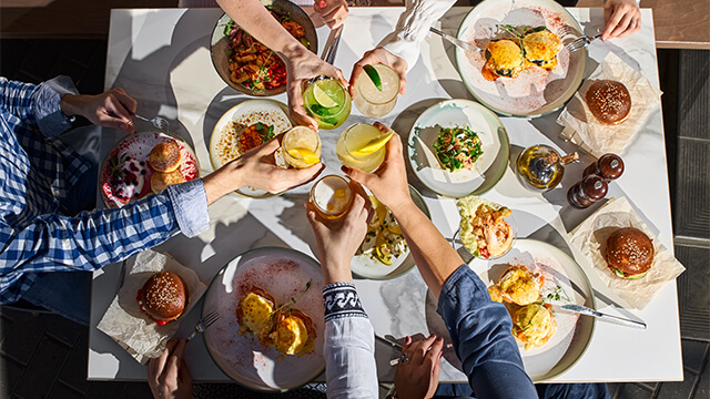 Group of people having food and drinks